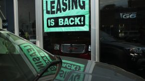 A leasing sign is displayed in a window