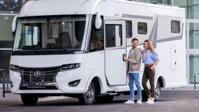 A couple entering a Mercedes-Benz RV during the Caravan Salon motorhome and caravan trade fair