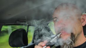 A man vaping while driving his car in Gdansk, Poland