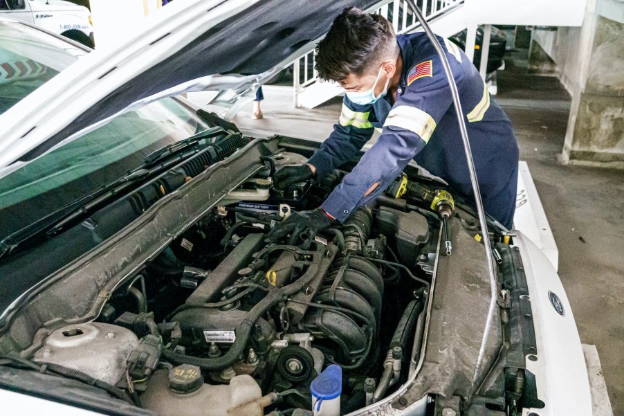 a mechanic works on a car