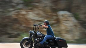 A man rides a motorcycle on the road to Mt. Rushmore on August 9, 2021, near Keystone, South Dakota. Motorcycle equipment rules dictate handlebar position, among other things.