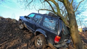 A 4x4 Ford Explorer SUV crashed into a tree while mudding