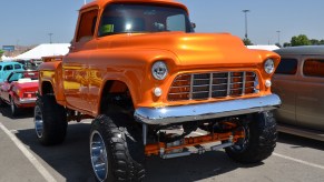 A 1955 Chevy pickup with a raised suspension and huge off-road tires in August 2017 in Reno, Nevada