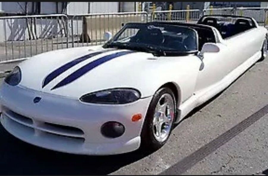 A white 1996 Dodge Viper limousine outside.