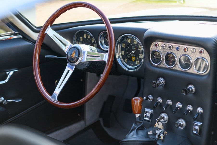 The inside of a car with a manual transmission.