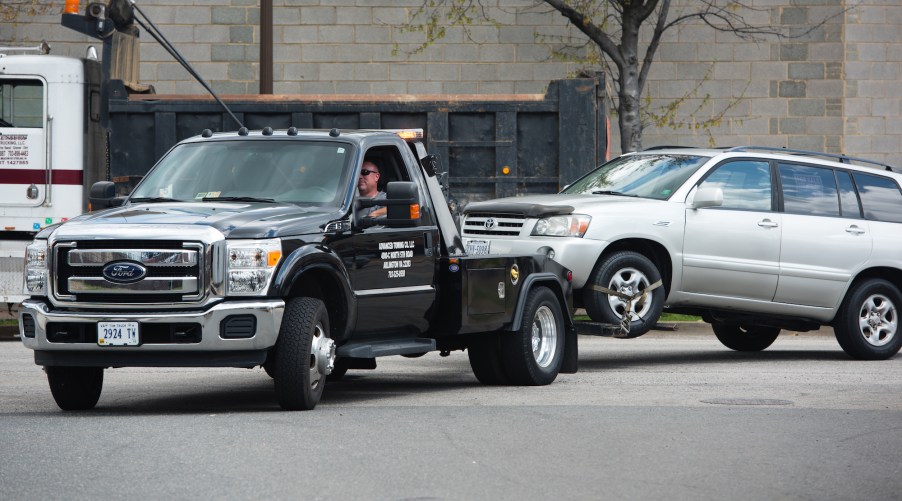 A tow truck from Advance Towing pulls a Toyota SUV in Arlington, Virginia, in 2015