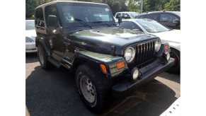 a green 1996 Jeep Wrangler TJ