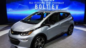 A silver 2017 Chevy Bolt, which has among those recalled, against a blue background with white print on it.