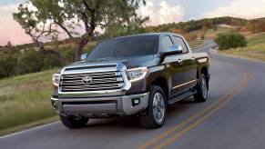 a brown 2018 toyota tundra drives down a winding road