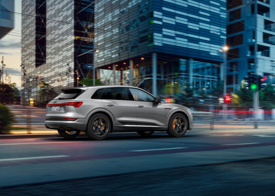 A 2021 Audi e-tron S Line Black Edition on a city street at dusk