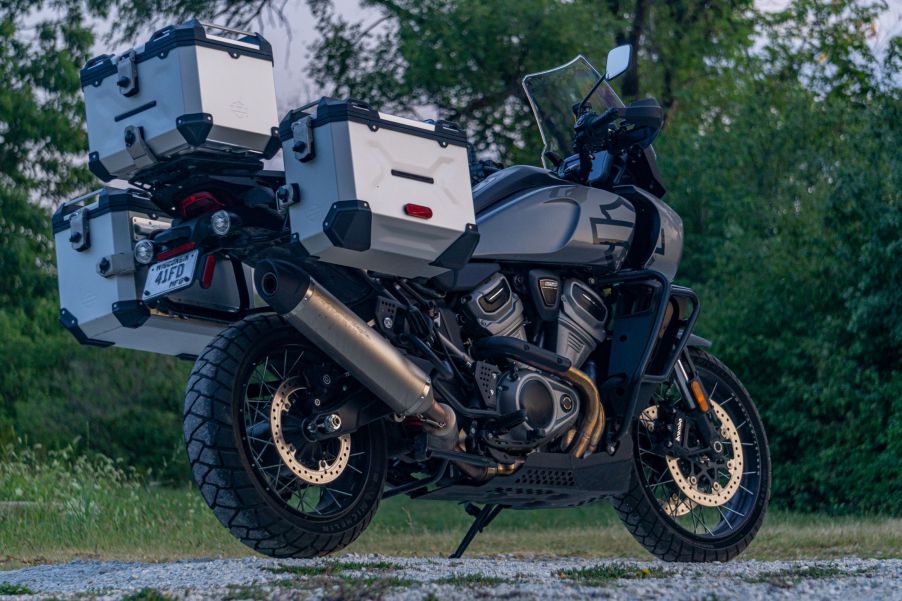 A low-angle rear 3/4 view of a gray-and-black 2021 Harley-Davidson Pan America 1250 Special with accessories