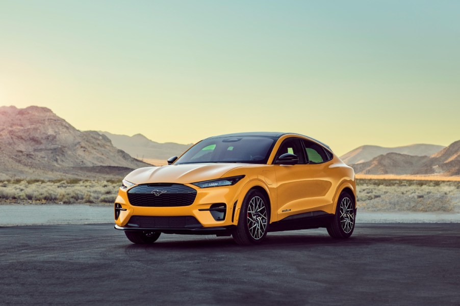 A yellow 2021 Ford Mustang Mach-E on the pavement