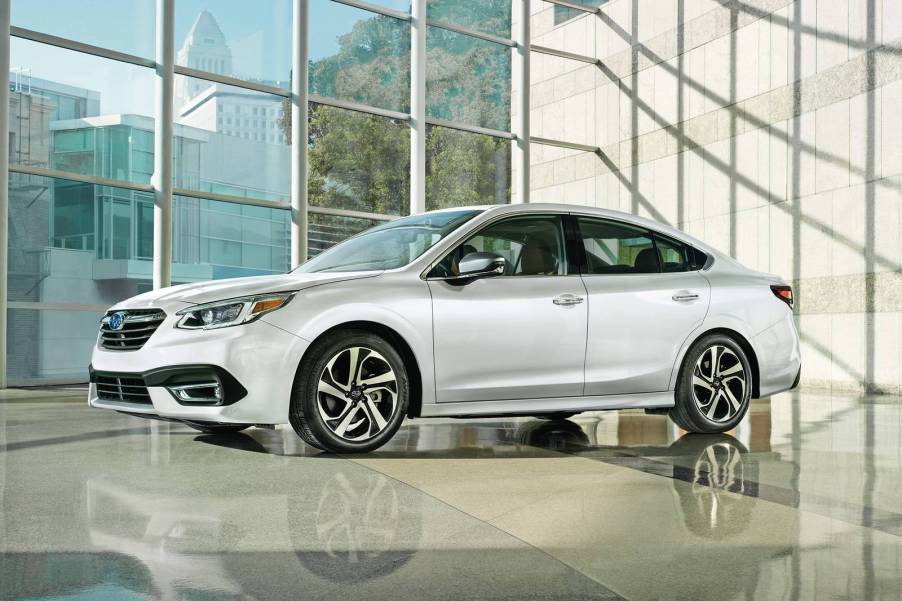 A silver 2021 Subaru Legacy parked in a showroom