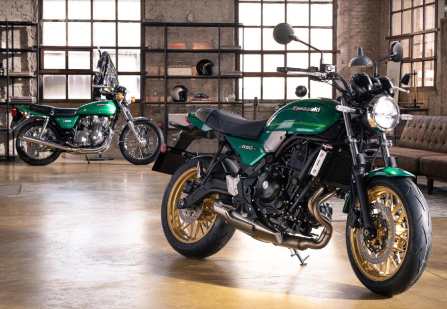 A green-and-black 2022 Kawasaki Z650RS with a green 1976 Kawasaki Z650 in the background