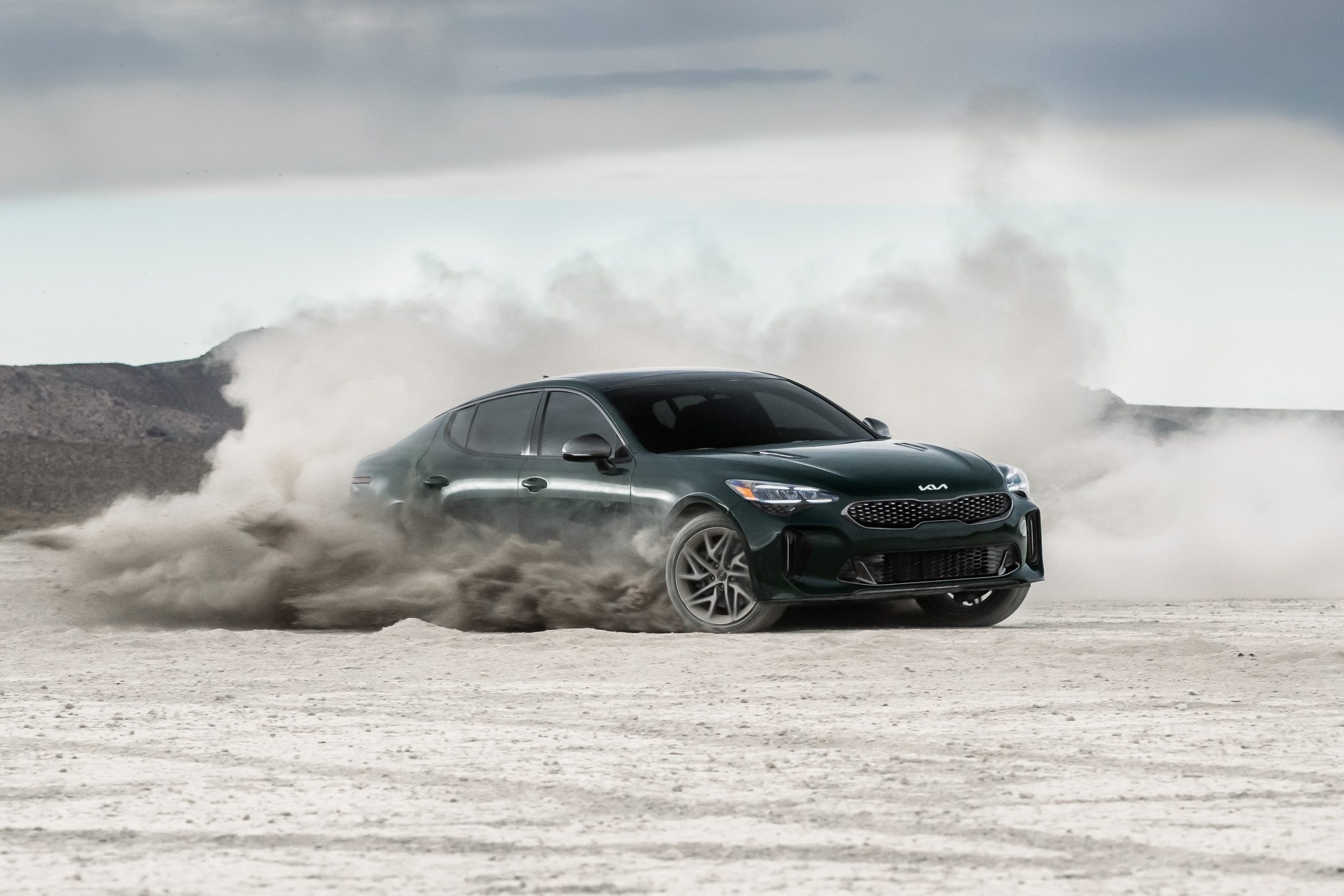 A black Stinger GT-Line gets sideways in the sand