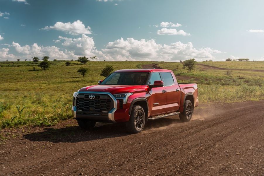 A red 2022 Toyota Tundra on a dirt road