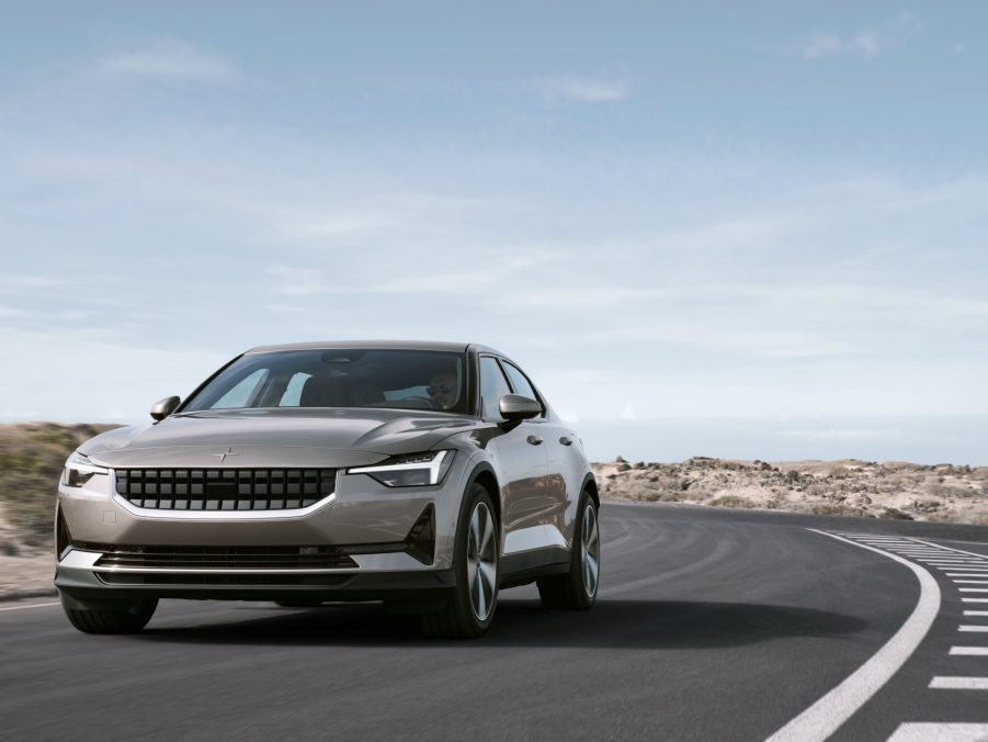 The 2022 Polestar 2 in a very Swedish shade of gold-grey on a B road