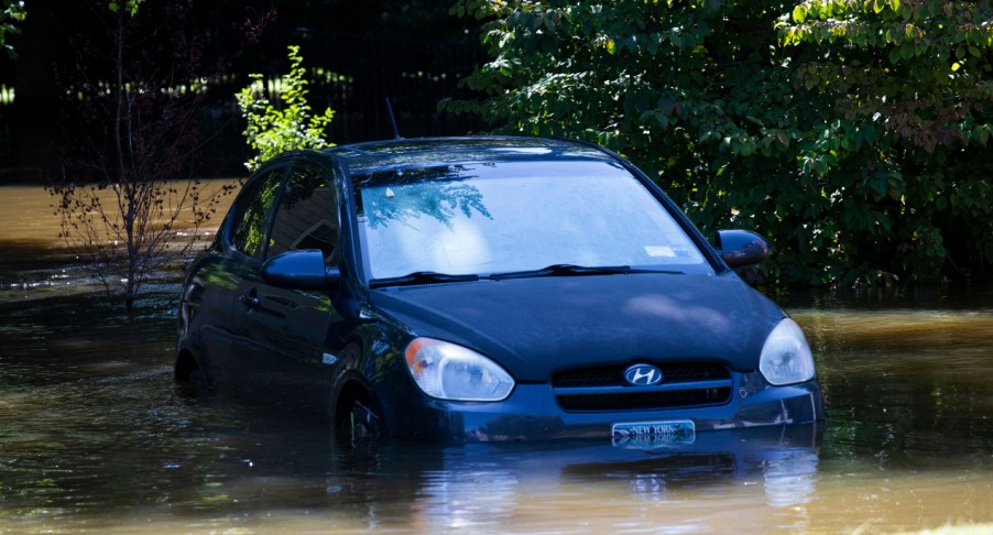 A car sits in a flooded parking spot after a night of high winds and rain from the remnants of Hurricane Ida