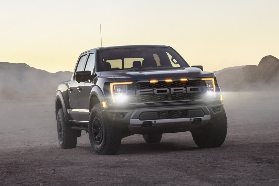 Black 2021 Ford F-150 Raptor with mountains in the background