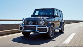 Black Mercedes-AMG G 63 driving on a highway