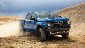 Blue 2022 Chevrolet Silverado ZR2 driving on desert terrain