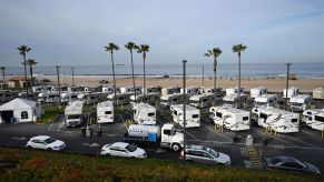 Camper RV park in front of a beach.