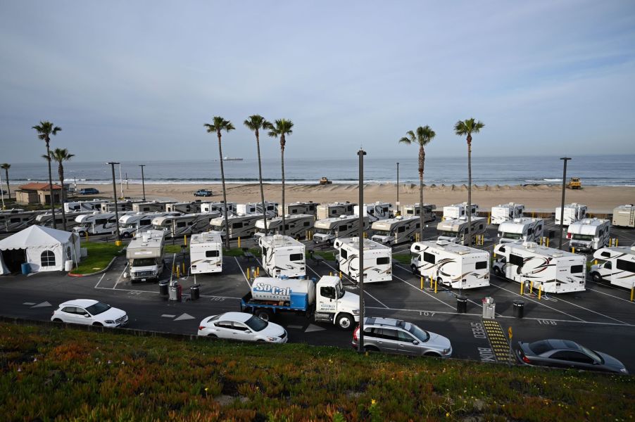 Camper RV park in front of a beach.