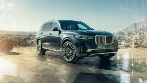 Dark blue 2022 BMW X7 parked on a desert landscape