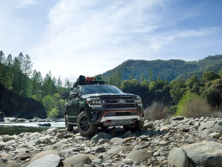 A black 2022 Ford Expedition Timberline driving through the mountains.