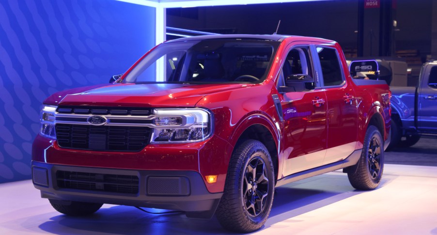 A red Ford Maverick compact pickup truck.