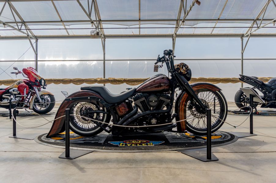 Fornarelli Motorsports' custom 2010 Harley-Davidson Fat Boy Lo next to two other custom bikes at IMS Outdoors Chicago 2021