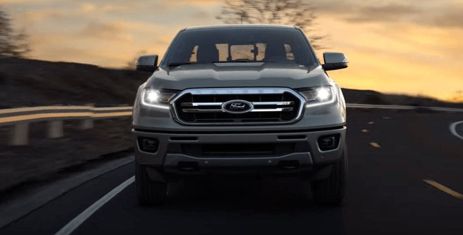 Front view of gray Ford Ranger with the headlamps turned on