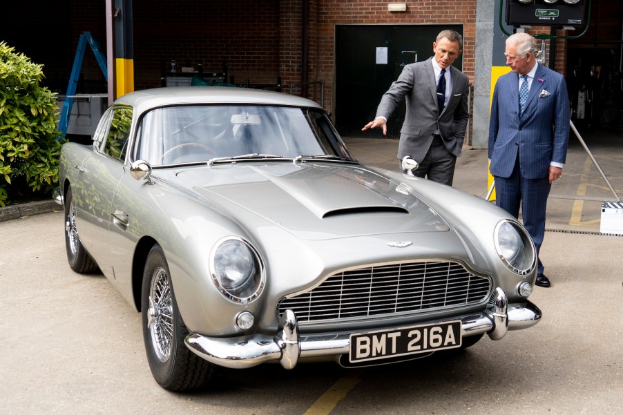 Daniel Craig and Prince Charles discussing James Bond's classic cars