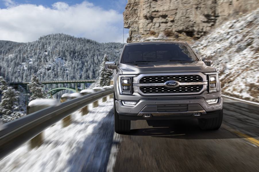 Gray 2022 Ford F-150 driving on a mountainous road