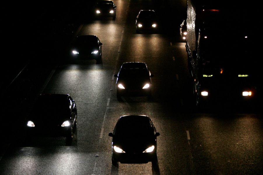 Sets of headlights on a highway.