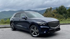 The 2022 Genesis GV70 in front of mountains