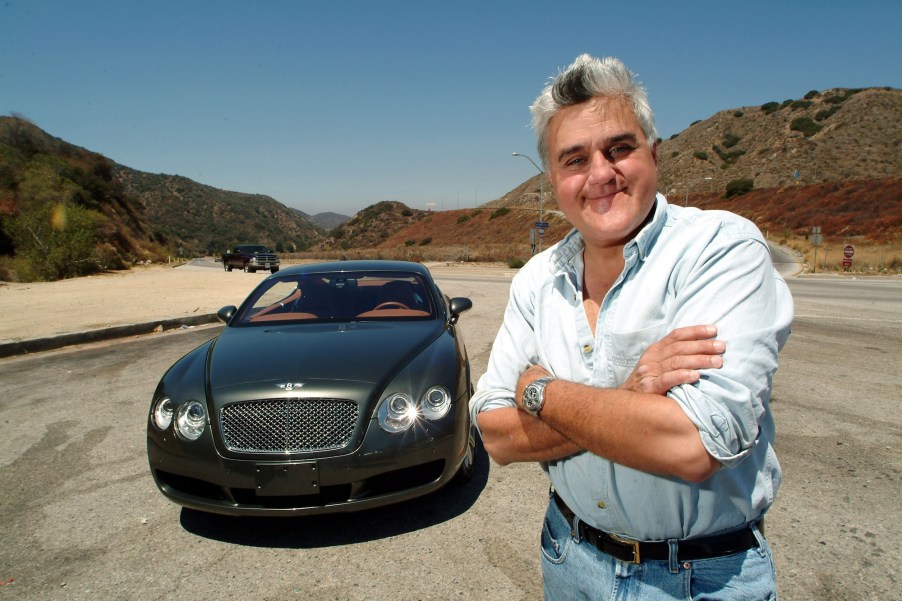 Celebrity car collector Jay Leno stands next to a 2004 Bentley S2 coupe