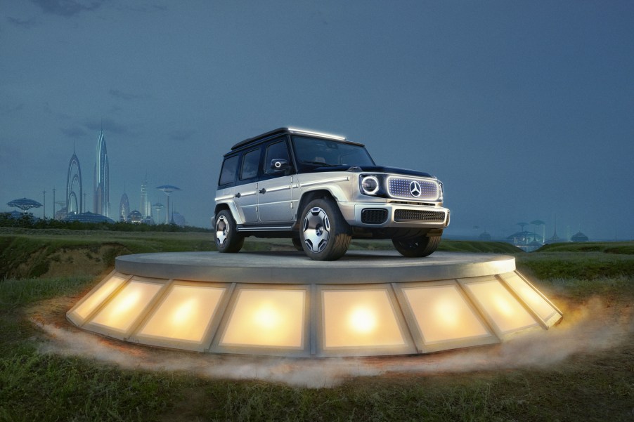 The black-and-silver Mercedes-Benz Concept EQG on a plinth in a field