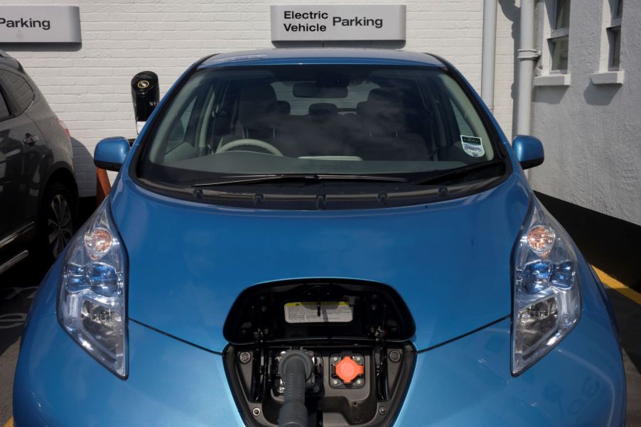 A Nissan Leaf charging in a parking garage at a South London dealership