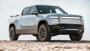 Passenger's side front angle view of gray Rivian R1T electric pickup truck