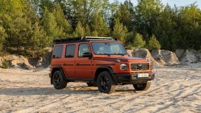 Passenger's side front angle view of orange Mercedes-Benz G-Class Professional Line Exterior