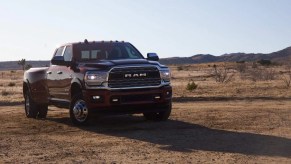 A maroon 2021 Ram 1500 in a desert.