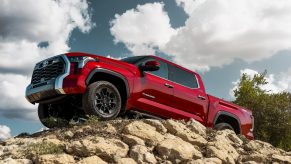 Red 2022 Toyota Tundra parked on a pile of rocks