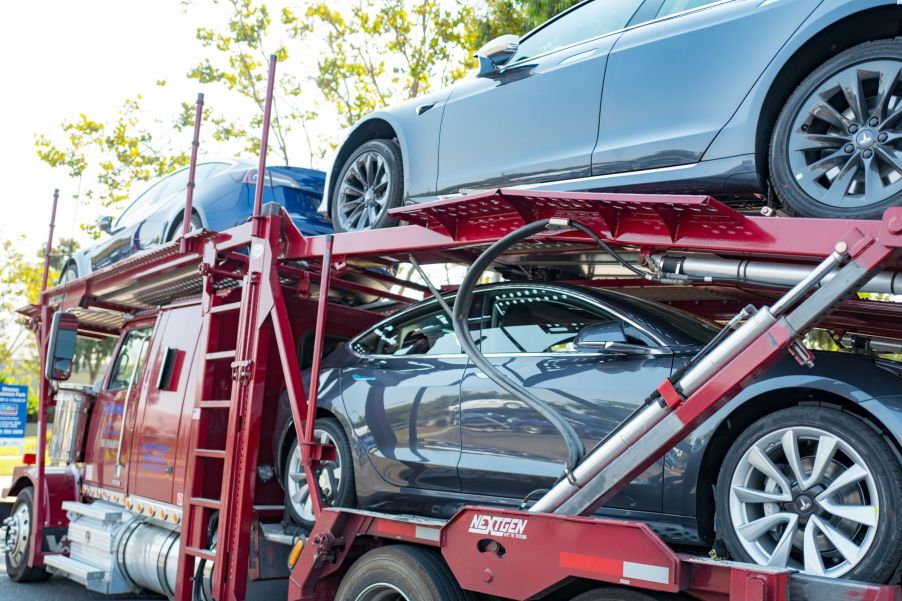 A Tesla delivery truck filled with Tesla Model 3 vehicles