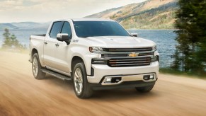 A white 2021 Chevy Silverado on a dirt road.