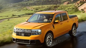 Yellow Ford Maverick driving on the road