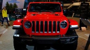 A red Jeep Wrangler is displayed.