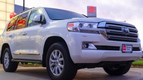 A white Toyota Land Cruiser is on display.