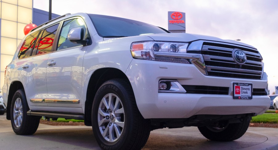 A white Toyota Land Cruiser is on display.