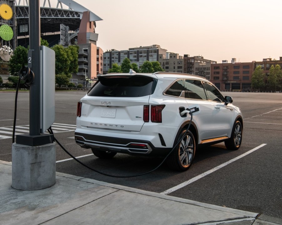 White 2022 Kia Sorento Plug-In Hybrid charging at a charging station